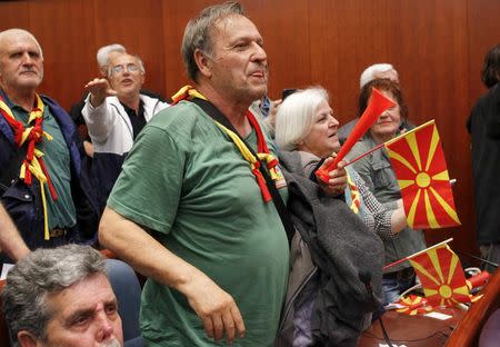 Protesters entered Macedonia's parliament after the governing Social Democrats and ethnic Albanian parties voted to elect an Albanian as parliament speaker in Skopje. Macedonia April 27, 2017. REUTERS/Ognen Teofilovski