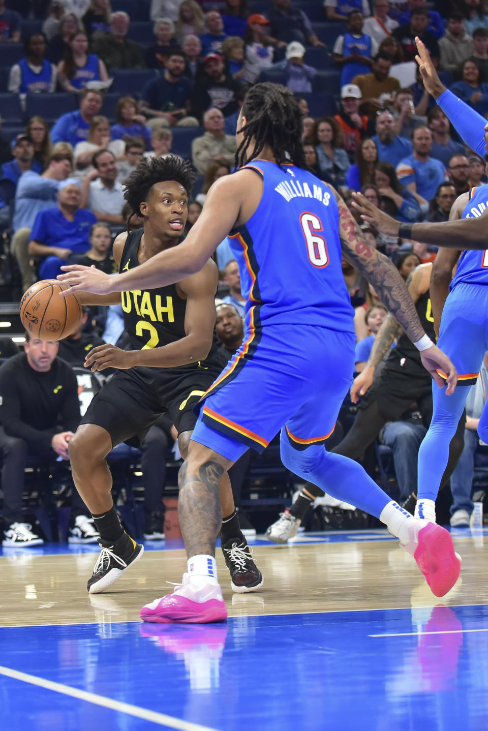 Utah Jazz guard Collin Sexton (2) looks for a opening past Oklahoma City Thunder forward Jaylin Williams (6) in the second half of an NBA basketball game, Wednesday, March 20, 2024, in Oklahoma City. (AP Photo/Kyle Phillips)