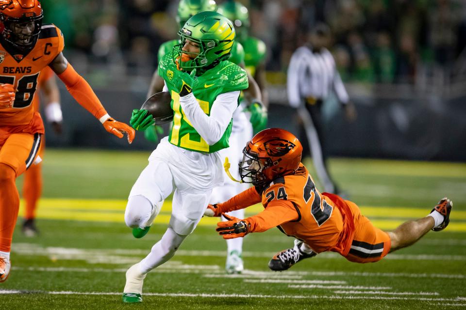 Oregon wide receiver Tez Johnson picks up yards for the Ducks as the No. 6 Oregon Ducks take on the No. 16 Oregon State Beavers Nov. 24, 2023, at Autzen Stadium in Eugene.