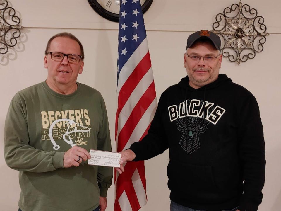 Manitowoc County Fish & Game Banquet Chairman Dan Becker (from left) turns over a check for $50,000 to Fish & Game Treasurer Randy Peters. This money will be used for conservation projects throughout Manitowoc County. Without this banquet, many projects just would not be able to be completed, so a huge thank-you needs to go out to banquet participants and prize donors for their support.