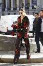 <p>While out in Paris during PFW, Gigi wore black and red floral separates by Jenny Packham, accessorized with a Versace backpack. </p>