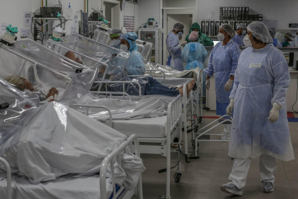 Doctors and nurses working checking on patients.