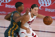 Miami Heat's Kelly Olynyk, right, is defended by Oklahoma City Thunder's Devon Hall during the second half of an NBA basketball game Wednesday, Aug. 12, 2020, in Lake Buena Vista, Fla. (Kevin C. Cox/Pool Photo via AP)