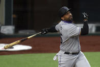 Colorado Rockies' Matt Kemp watches his RBI-single against the Texas Rangers in the fourth inning of a baseball game Saturday, July 25, 2020, in Arlington, Texas. (AP Photo/Richard W. Rodriguez)