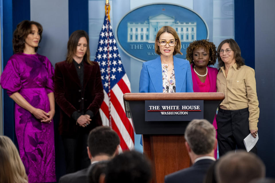 "The L Word" cast member Leisha Hailey, center, accompanied by fellow cast members Jennifer Beals, left, and Katherine Moennig, second from left, Television producer and "The L Word" co-creator Ilene Chaiken, right, and White House press secretary Karine Jean-Pierre, second from right, speaks during a press briefing at the White House in Washington, Tuesday, April 25, 2023, to mark Lesbian Visibility Week. (AP Photo/Andrew Harnik)