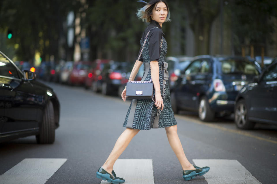 Irene Kim in green plastic shoes at Milan Fashion Week 2015. 