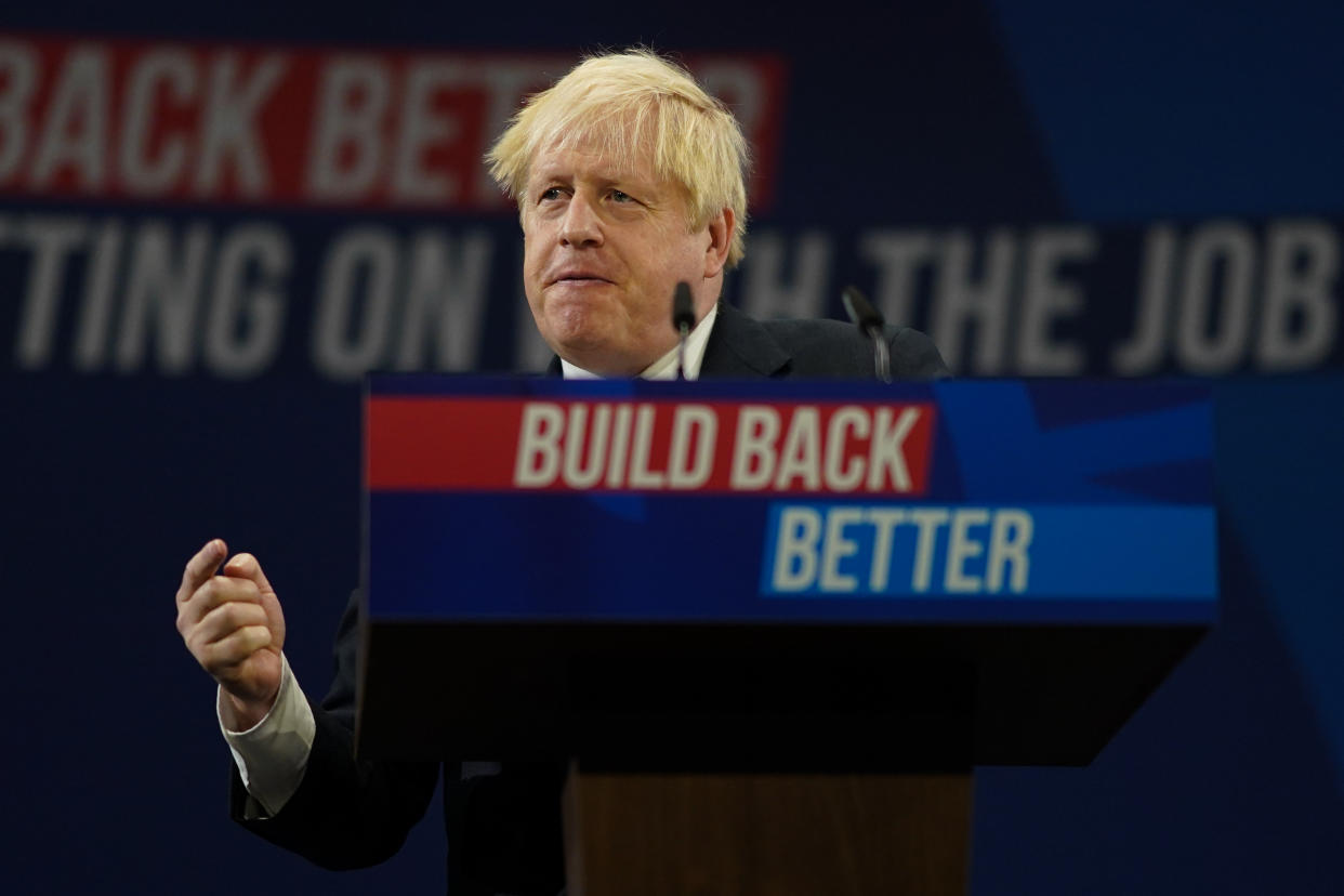 MANCHESTER, ENGLAND - OCTOBER 06: Britain's Prime Minister Boris Johnson delivers his leader's keynote speech during the Conservative Party conference at Manchester Central Convention Complex on October 6, 2021 in Manchester, England. This year's Conservative Party Conference returns as a hybrid of in-person and online events after last year it was changed to a virtual event due to the Coronavirus pandemic. Boris Johnson addresses the party as its leader for the third time. (Photo by Ian Forsyth/Getty Images)