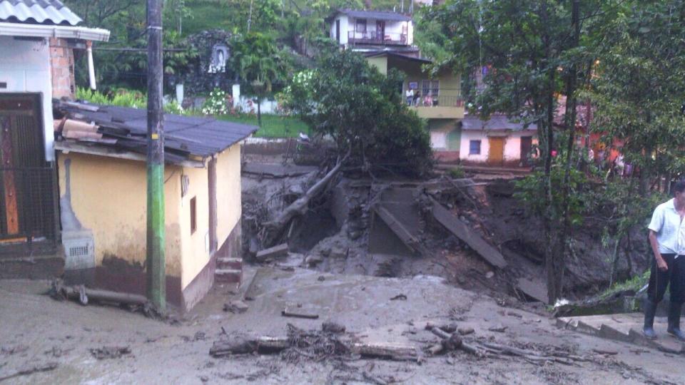 A street of the municipality of Salgar in Antioquia department is seen covered in mud and debris after a landslide in this May 18, 2015 handout image provided by Colombian Air Force. A landslide sent mud and water crashing onto homes in a town in Colombia's northwest mountains on Monday, killing at least 48 people and injuring dozens, officials said. Heavy rains caused a ravine to overflow, sending mud and water onto neighboring homes in Salgar. REUTERS/Colombian Air Force/Handout via Reuters ATTENTION EDITORS - THIS PICTURE WAS PROVIDED BY A THIRD PARTY. REUTERS IS UNABLE TO INDEPENDENTLY VERIFY THE AUTHENTICITY, CONTENT, LOCATION OR DATE OF THIS IMAGE. FOR EDITORIAL USE ONLY. NOT FOR SALE FOR MARKETING OR ADVERTISING CAMPAIGNS. THIS PICTURE IS DISTRIBUTED EXACTLY AS RECEIVED BY REUTERS, AS A SERVICE TO CLIENTS.