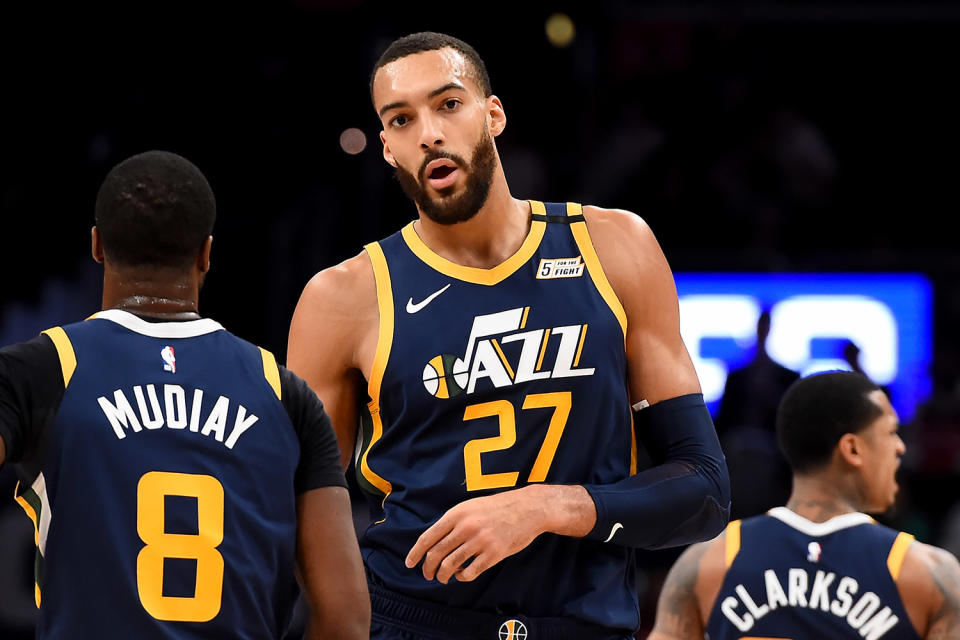 <p>Prior to his <a href="https://people.com/sports/rudy-gobert-touched-reporters-recorders-before-testing-positive-for-coronavirus/" rel="nofollow noopener" target="_blank" data-ylk="slk:positive diagnosis;elm:context_link;itc:0;sec:content-canvas" class="link ">positive diagnosis</a>, the Utah Jazz player was seen wiping his hands on the mouthpiece of several microphones attached to a podium before leaving a press conference. </p> <p>"As part of the Jazz's COVID-19 response, shootaround availability was done in the ZBBC media room today rather than on the court. As Rudy Gobert got finished discussing the situation, he stood up, leaned over and made it a point to touch every mic and recorder in front of him," <em>Salt Lake Tribune</em>'s Eric Walden <a href="https://twitter.com/tribjazz/status/1237077216661360650" rel="nofollow noopener" target="_blank" data-ylk="slk:reported;elm:context_link;itc:0;sec:content-canvas" class="link ">reported</a>.</p> <p>After <a href="https://people.com/health/nba-suspends-season-after-utah-jazz-player-rudy-gobert-tests-positive-for-coronavirus/" rel="nofollow noopener" target="_blank" data-ylk="slk:Gobert tested positive;elm:context_link;itc:0;sec:content-canvas" class="link ">Gobert tested positive</a>, the NBA announced the league will be suspending the remainder of the season until further notice.</p>