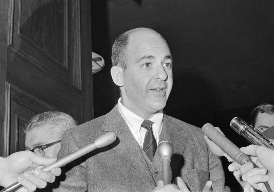 FILE - Dr. Cyril Wecht of Pittsburgh, a witness during the hearings to exhume the body of Mary Jo Kopechne, who testified that in his opinion the body should be exhumed, talks to reporters, Oct. 21, 1969, in Wilkes-Barre, Pa. Wecht, a pathologist and attorney whose biting cynicism and controversial positions on high-profile deaths such as President John Kennedy’s 1963 assassination caught the attention of prosecutors and TV viewers alike, died Monday, May 13, 2024. He was 93. (AP Photo/Paul Vathis, File)