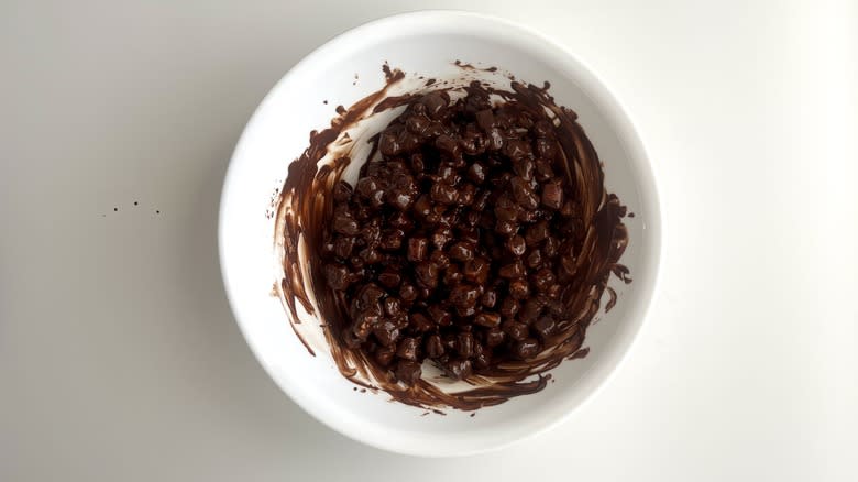 Marshmallows in melted chocolate in bowl