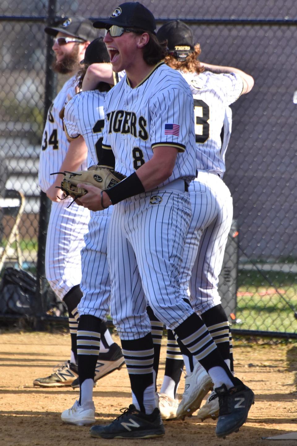 Harry S. Truman senior Andrew Armstrong celebrates during the Tigers' five-run seventh inning in a 6-4 victory over Archbishop Wood.