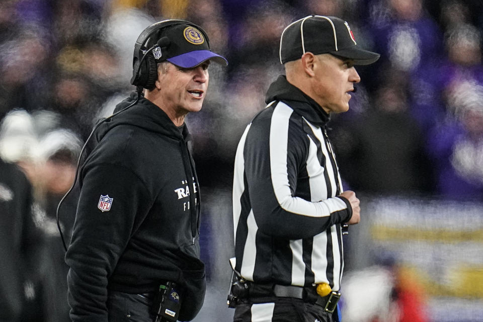 Baltimore Ravens head coach John Harbaugh speaks to an official during the second half of an AFC Championship NFL football game against the Kansas City Chiefs, Sunday, Jan. 28, 2024, in Baltimore. (AP Photo/Julio Cortez)