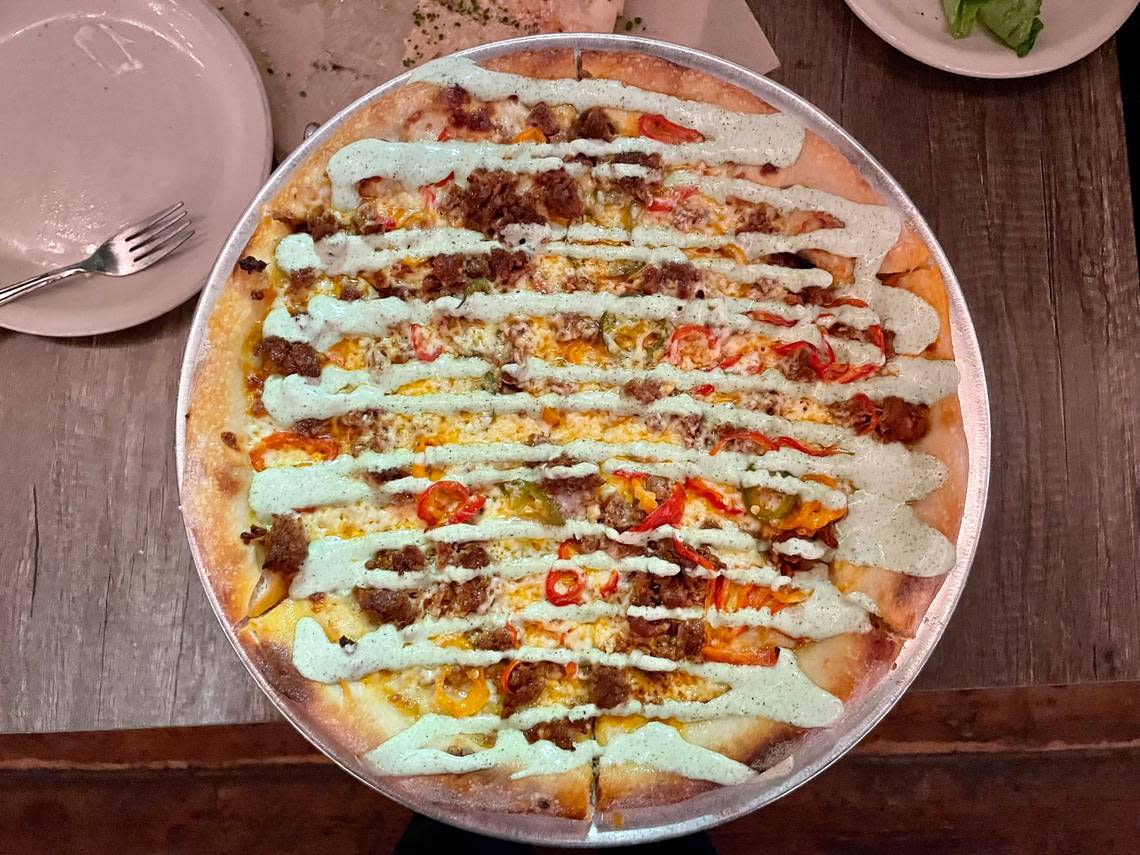 Pizzeria Luba’s Coronado pizza features chorizo, Hatch chile jack cheese, pickled peppers, roasted garlic cream sauce and an aji verde drizzle. Benjy Egel/The Sacramento Bee