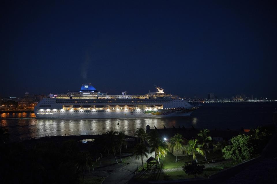 A ship of the Norwegian Cruise Line leaves the bay of Havana at dawn, in Havana, Cuba, Wednesday, June 5, 2019. The Trump administration has imposed major new travel restrictions on visits to Cuba by U.S. citizens, banning stops by cruise ships and ending a heavily used form of educational travel as it seeks to further isolate the communist government. (AP Photo/Ramon Espinosa)