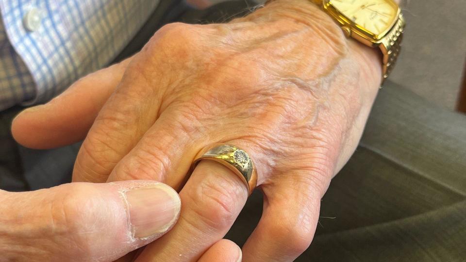 David Conn rubbing his wedding band