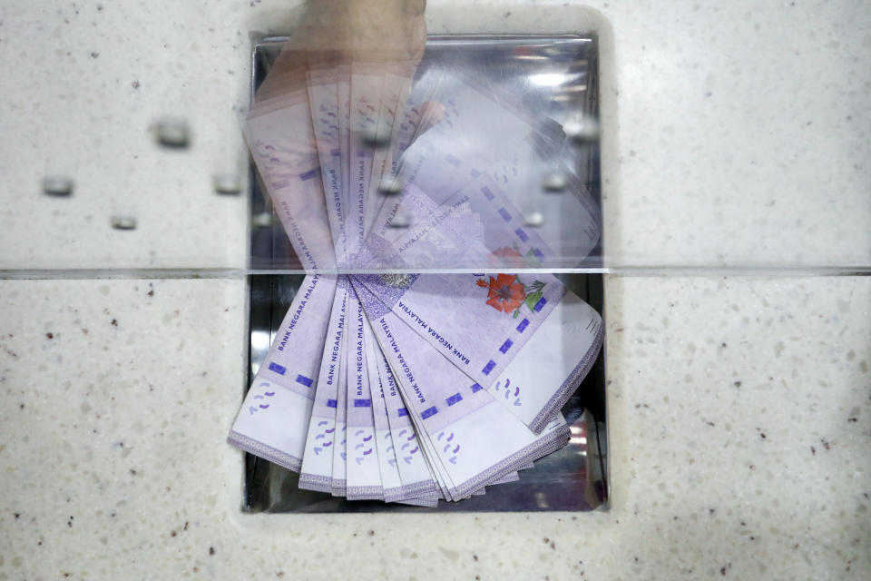 Malaysian hundred ringgit banknotes at a currency exchange store in Kuala Lumpur, Malaysia, on Friday, March. 1, 2024. 