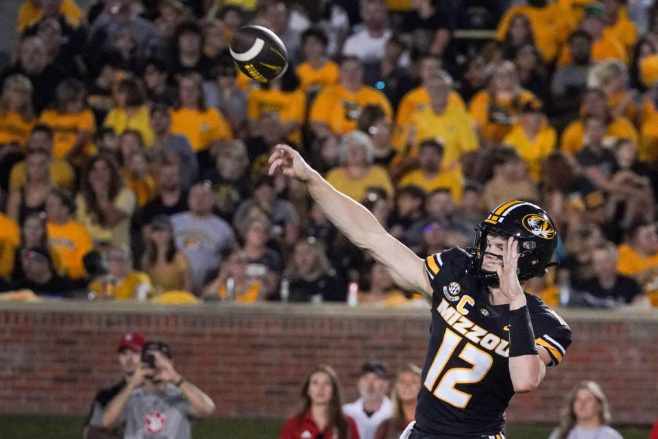 Missouri Tigers quarterback Brady Cook lofts a pass against the South Dakota Coyotes during Thursday night’s season-opening game at Faurot Field in Columbia.