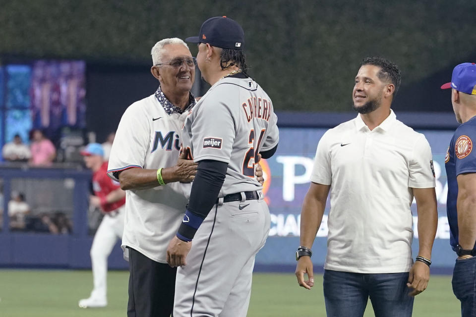 Detroit Tigers' Miguel Cabrera (24) greets former MLB player Dave Concepcion during a pre-game ceremony before a baseball game against the Miami Marlins, Saturday, July 29, 2023, in Miami. (AP Photo/Marta Lavandier)