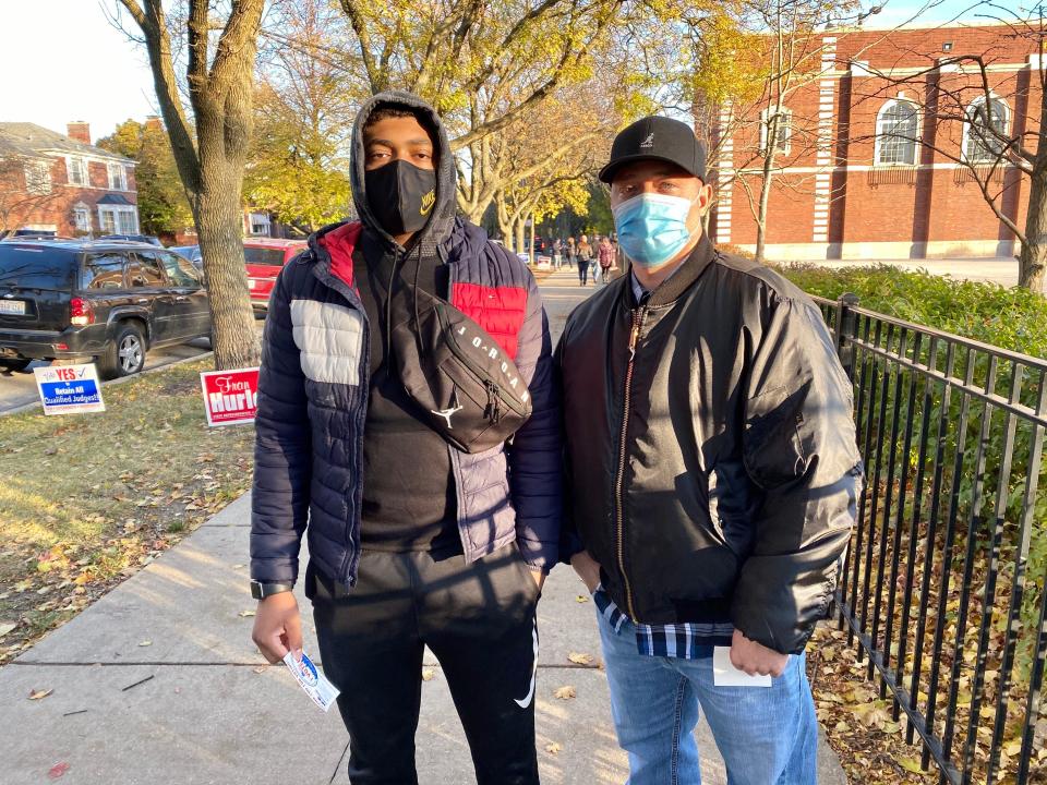 Rasul Freelain, right, a police sergeant, and his son, Diata Freelain, voted for Joe Biden Tuesday at an elementary school on Chicago’s Far Southwest Side. "He has a sense of fairness and respectful interactions for all, regardless of what they may believe,” said Rasul Freelain.