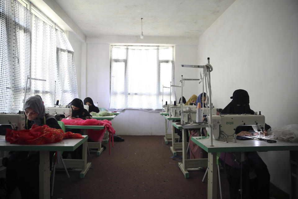 Afghan women tailors work with a sewing machine in the Afghan Women Business Hub in Kabul, Afghanistan, Tuesday, July 2, 2024. Half of Afghanistan's population now finds itself locked out of the freedom to work at a time when the country's economy is worse than ever, with few jobs available to women in the country.(AP Photo/Siddiqullah Alizai)