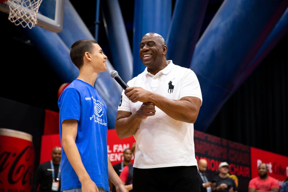 Earvin 'Magic' Johnson, star of Coke Zero Sugar's latest March Madness campaign, meets Boys & Girls Club of Greater Houston's 2023 Julius Young Youth of the Year recipient, Ky'Saan Paitti, at the Coca-Cola Zero Sugar Fan Fest activation before taking center court for a game of Z.E.R.O. on Saturday, April 1, 2023, in Houston.