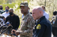 Brig. Gen. Michael J. Talley, commander of U.S. Army Medical Research and Development Command Fort Detrick, Md., left, joined by Frederick Maryland Police Chief Jason Lando, right, speaks during a news conference near the scene of a shooting at a business park in Frederick, Md., Tuesday, April 6, 2021. (AP Photo/Carolyn Kaster)