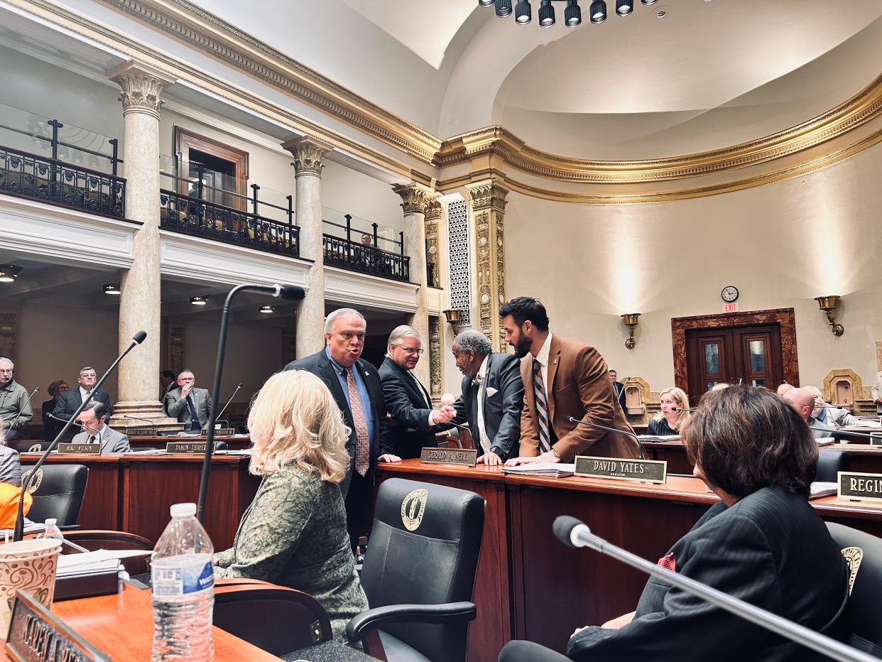 Senate President Robert Stivers and Senate Majority Leader Damon Thayer, both Republicans, confront Louisville Democrat Karen Berg (right) as Minority Leader Gerald Neal and David Yates, also Louisville Democrats, try to keep the peace. Sen. Robin Webb, D-Grayson, sits in the foreground.