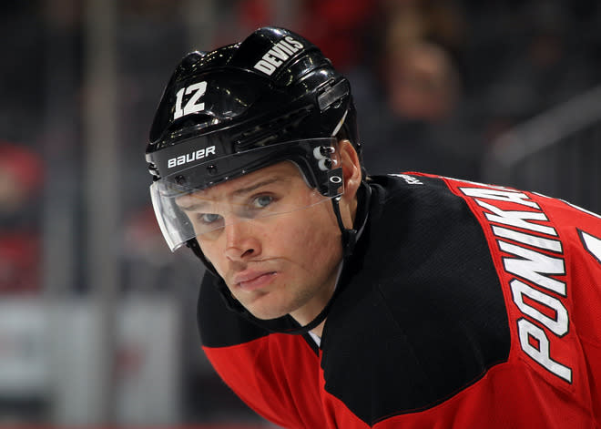 NEWARK, NJ - FEBRUARY 26: Alexei Ponikarovsky #12 of the New Jersey Devils waits for the faceoff during the game against the Tampa Bay Lightning at the Prudential Center on February 26, 2012 in Newark, New Jersey. (Photo by Bruce Bennett/Getty Images)