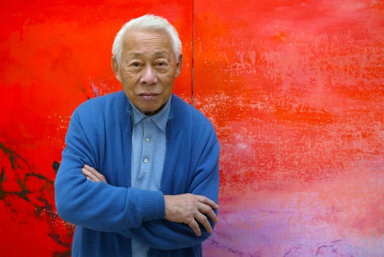 Franco-Chinese painter Zao Wou-Ki poses in his workshop in Paris on November 6, 2003. Zao a significant figure in 20th-century Chinese art, died at his home in Switzerland aged 93, a lawyer for his wife told AFP