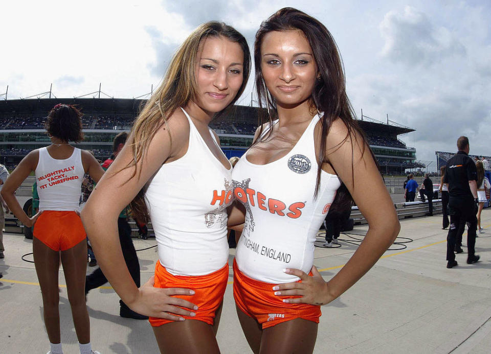 Hooters waitresses posing for a photo.