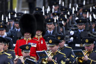 Members of the Armed Forces march on The Mall ahead of the State Opening of Parliament ceremony in London, Monday, Oct. 14, 2019. (AP Photo/Alberto Pezzali)