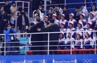 Ice Hockey – Pyeongchang 2018 Winter Olympics – Women's Preliminary Round Match – Korea v Japan - Kwandong Hockey Centre, Gangneung, South Korea – February 14, 2018 - A Kim Jong-un impersonator stands next to the North Korean cheerleaders. REUTERS/Brian Snyder