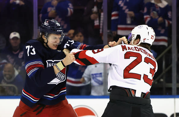 NEW YORK, NEW YORK – APRIL 03: Kurtis MacDermid #23 of the New Jersey Devils fights with Matt Rempe #73 of the New York Rangers during the first period at Madison Square Garden on April 03, 2024 in New York City. (Photo by Bruce Bennett/Getty Images)