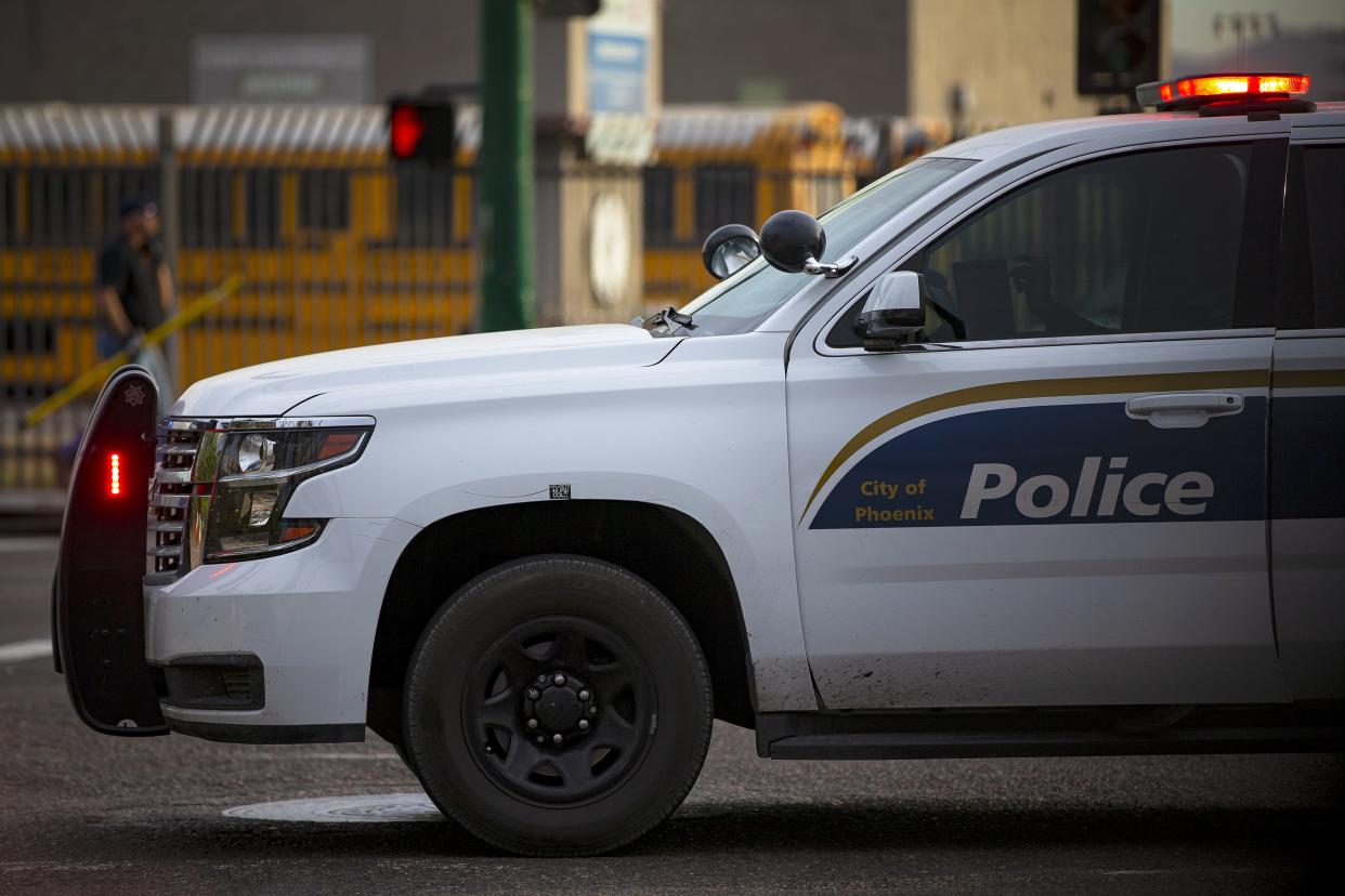 A car sideswiped another vehicle, leading to a woman, who was speaking to the driver of the front vehicle, to be fatally hit, Phoenix police said.