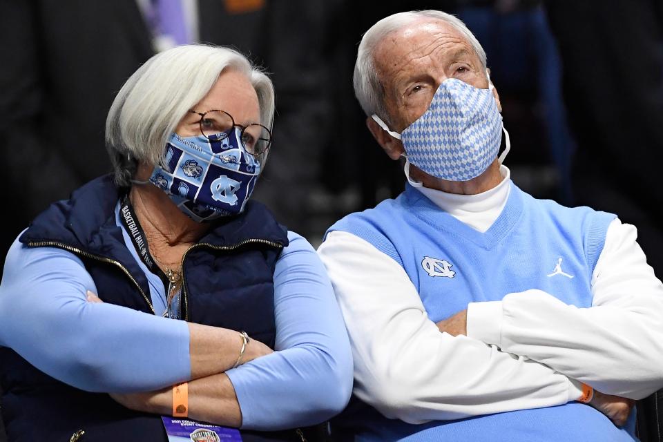 Former North Carolina coach Roy Williams, right, and his wife, Wanda Williams, look on from courtside seats while watching the Tar Heels play Purdue in the Hall of Fame Tip-off Tournament at the Mohegan Sun in November.