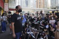 Spokesperson of Hong Kong Alliance in Support of Patriotic Democratic Movements of China, Richard Tsoi speaks to media after the group announced that it's disbanded in Hong Kong, Saturday, Sept. 25, 2021. (AP Photo/Kin Cheung)