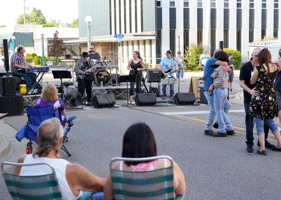 People dance and listen to the band Jaded Soul during the June 2021 First Fridays in downtown Adrian. Jaded Soul will perform at today's First Fridays from 7 to 9 p.m. at the corner of South Main and Toledo streets in downtown Adrian.