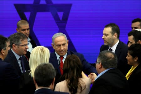 Israeli PM Netanyahu chats after delivering a statement in Ramat Gan, near Tel Aviv