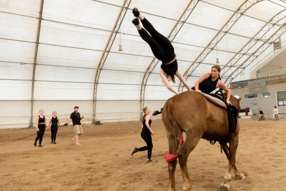 Jacey Muir, left, and Amber Terry practice their routine on horse Cabo San Lucas at Oak Hills Vaulting in Salem on July 7. The team will represent the USA at the FEI Vaulting World Championships for Juniors and Young Vaulters, taking place in Sweden.