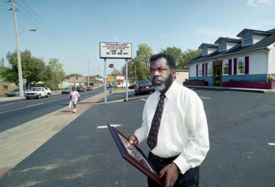 Woodcuts owner Nathaniel Harris stands in front of his shop at 17th Avenue North and Jefferson Street on Oct. 7, 1993. Harris is the chairman of the revitalization committee for the North Nashville area.