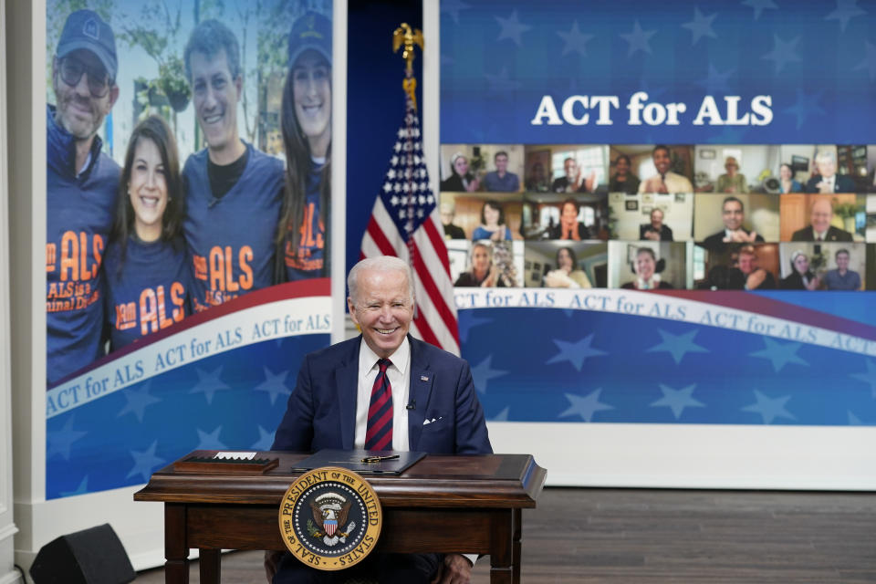 President Joe Biden smiles after signing the "Accelerating Access to Critical Therapies for ALS Act" into law during a ceremony in the South Court Auditorium on the White House campus in Washington, Thursday, Dec. 23, 2021. (AP Photo/Patrick Semansky)