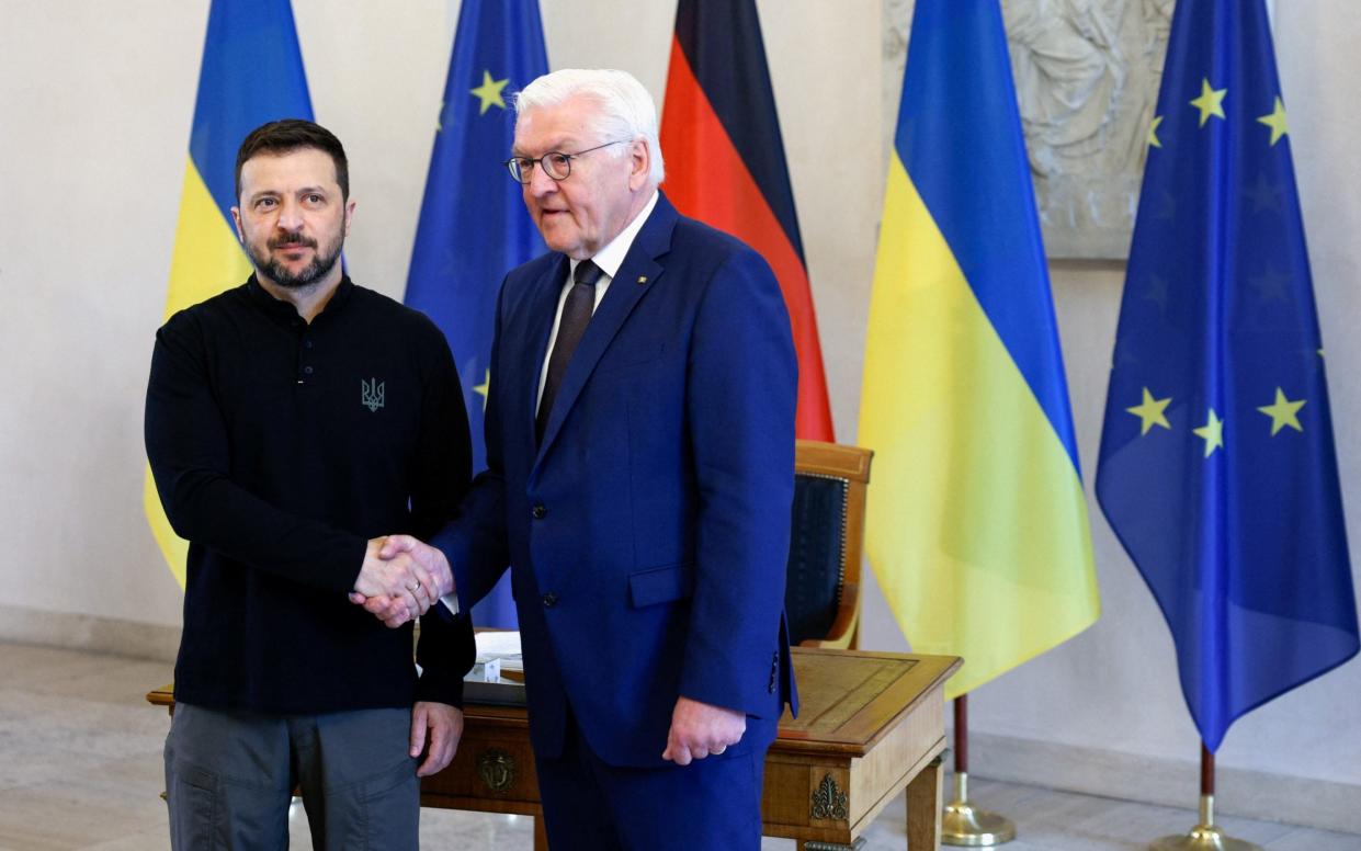 Ukrainian president Volodymyr Zelenskiy shakes hands with German president Frank-Walter Steinmeier