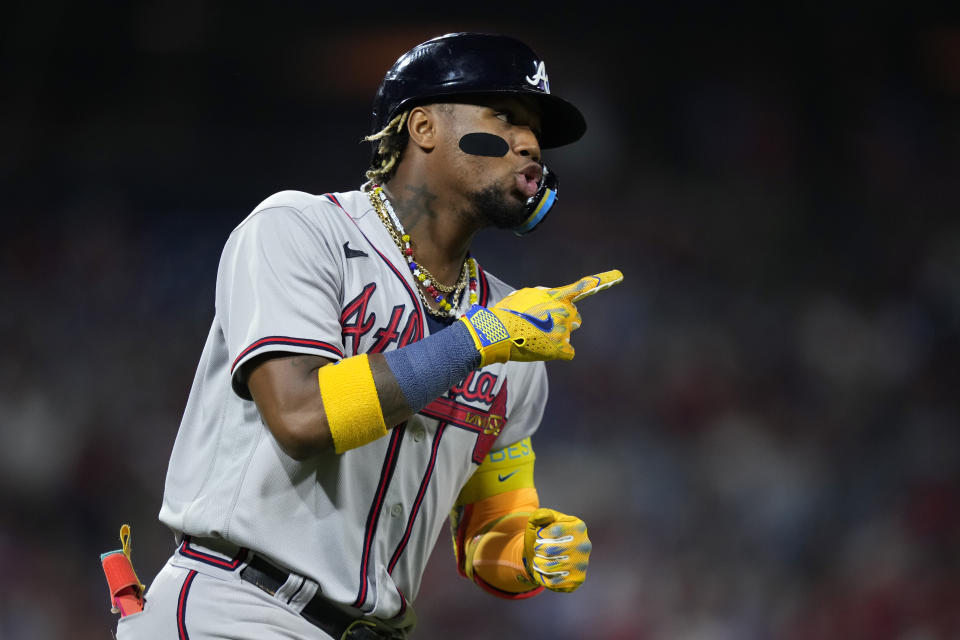 Atlanta Braves' Ronald Acuna Jr. reacts after hitting a two-run home run against Philadelphia Phillies pitcher Zack Wheeler during the fifth inning of a baseball game, Tuesday, Sept. 12, 2023, in Philadelphia. (AP Photo/Matt Slocum)