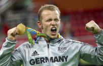 <p>Gold medalist Fabian Hambuchen of Germany celebrates winning the men’s horizontal bar final at the Rio Olympic Arena on August 16, 2016. (REUTERS/Ruben Sprich) </p>