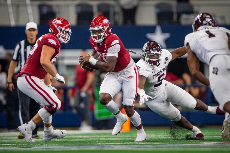 Arkansas quarterback KJ Jefferson carries the ball against Texas A&M during their 2021 game  at AT&T Stadium.