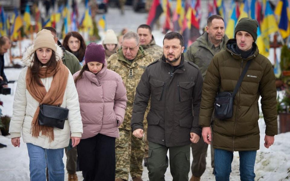 Volodymyr Zelensky visiting graves of Ukrainian soldiers