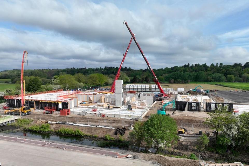 Cranes at work building the River Academy secondary school in Richfield Avenue, Reading. <i>(Image: Bowmer + Kirkland)</i>