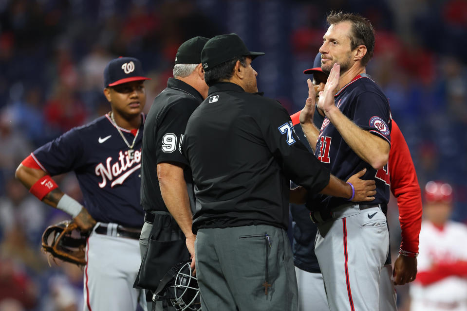 PHILADELPHIA, PA - JUNE 22: Pitcher Max Scherzer #31 of the Washington Nationals is searched for foreign substances by umpires Tim Timmons #95 and Alfonso Marquez #72 during the fourth inning of a game against the Philadelphia Phillies at Citizens Bank Park on June 22, 2021 in Philadelphia, Pennsylvania. (Photo by Rich Schultz/Getty Images)