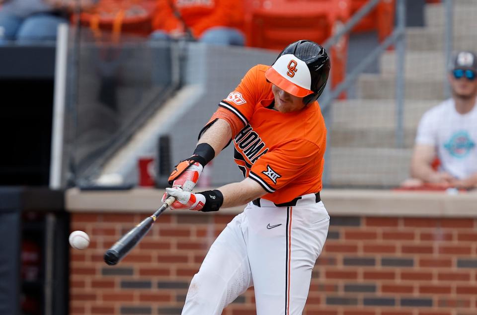 Oklahoma State's Nolan Schubart swings at a pitch during Tuesday's game against OU at O'Brate Stadium in Stillwater.